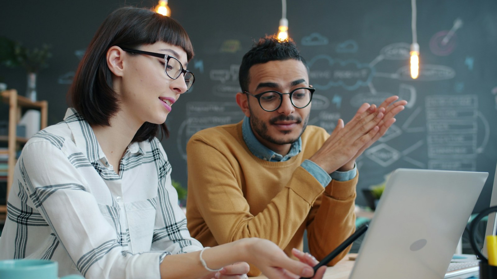 Two team members sharing ideas about a digital product